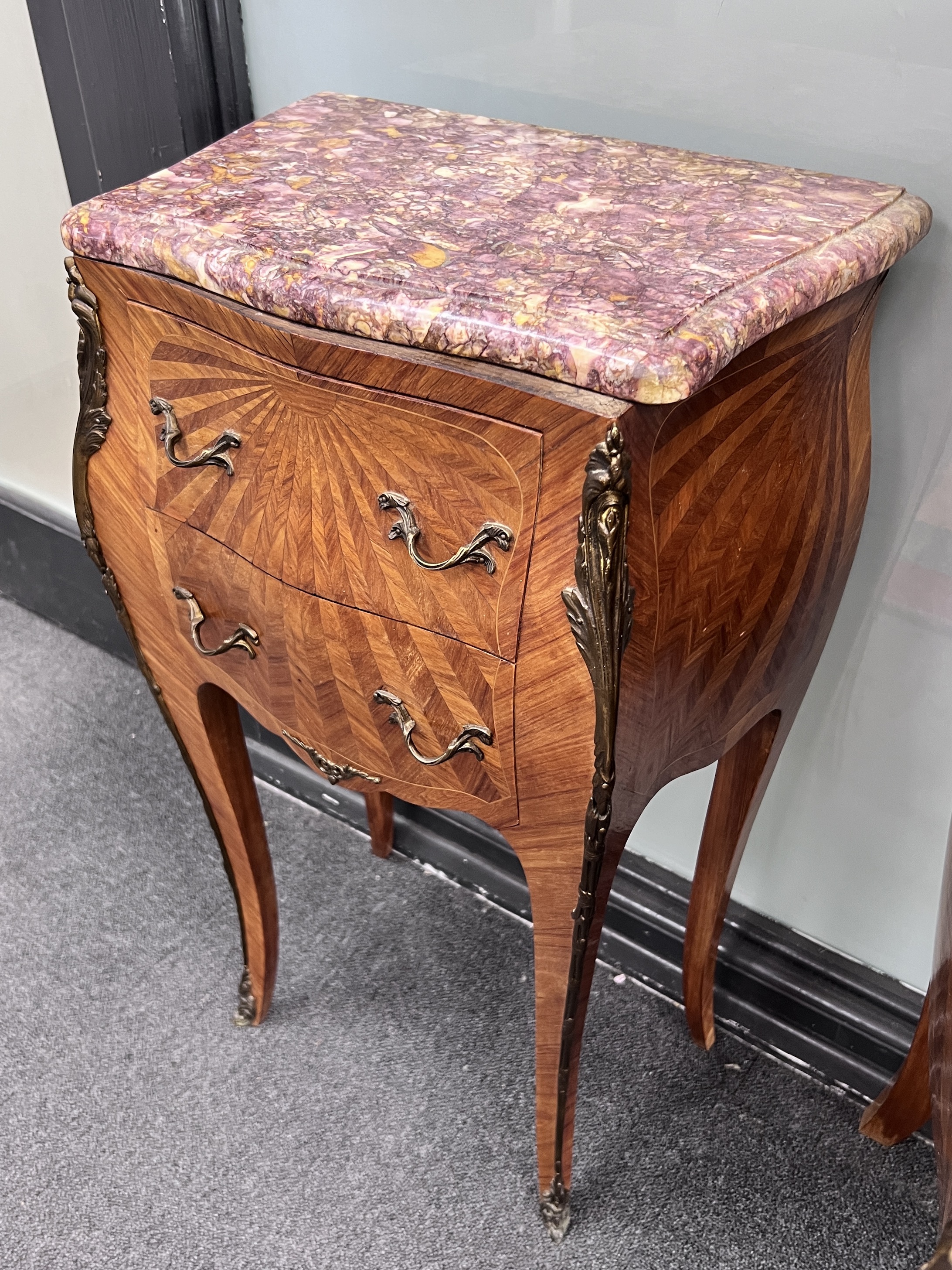 A pair of French Louis XV style parquetry bombe fronted rouge marble topped bedside cabinets, width 44cm, height 74cm